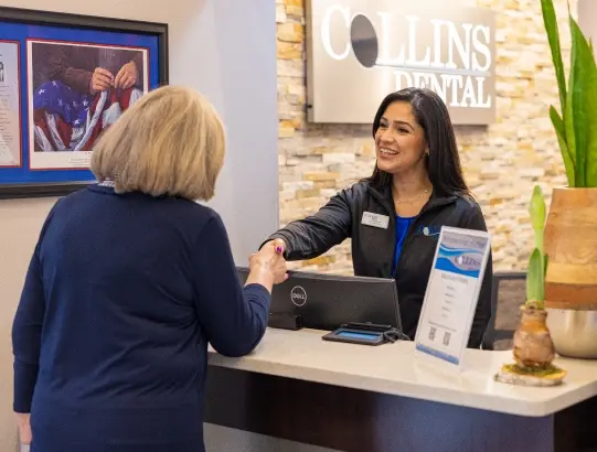 Collins Dental front desk staff welcoming a patient — Winter Springs, FL dental office