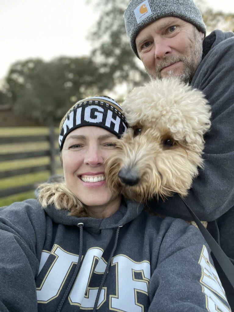 Dr. Collins with his wife and dog