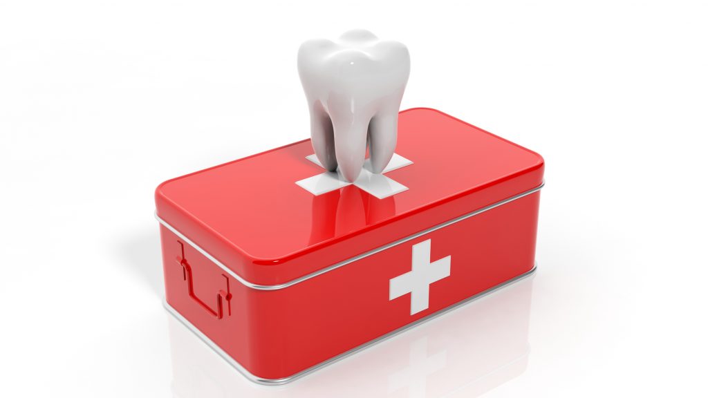 illustration of a white tooth on top of a first aid kit 